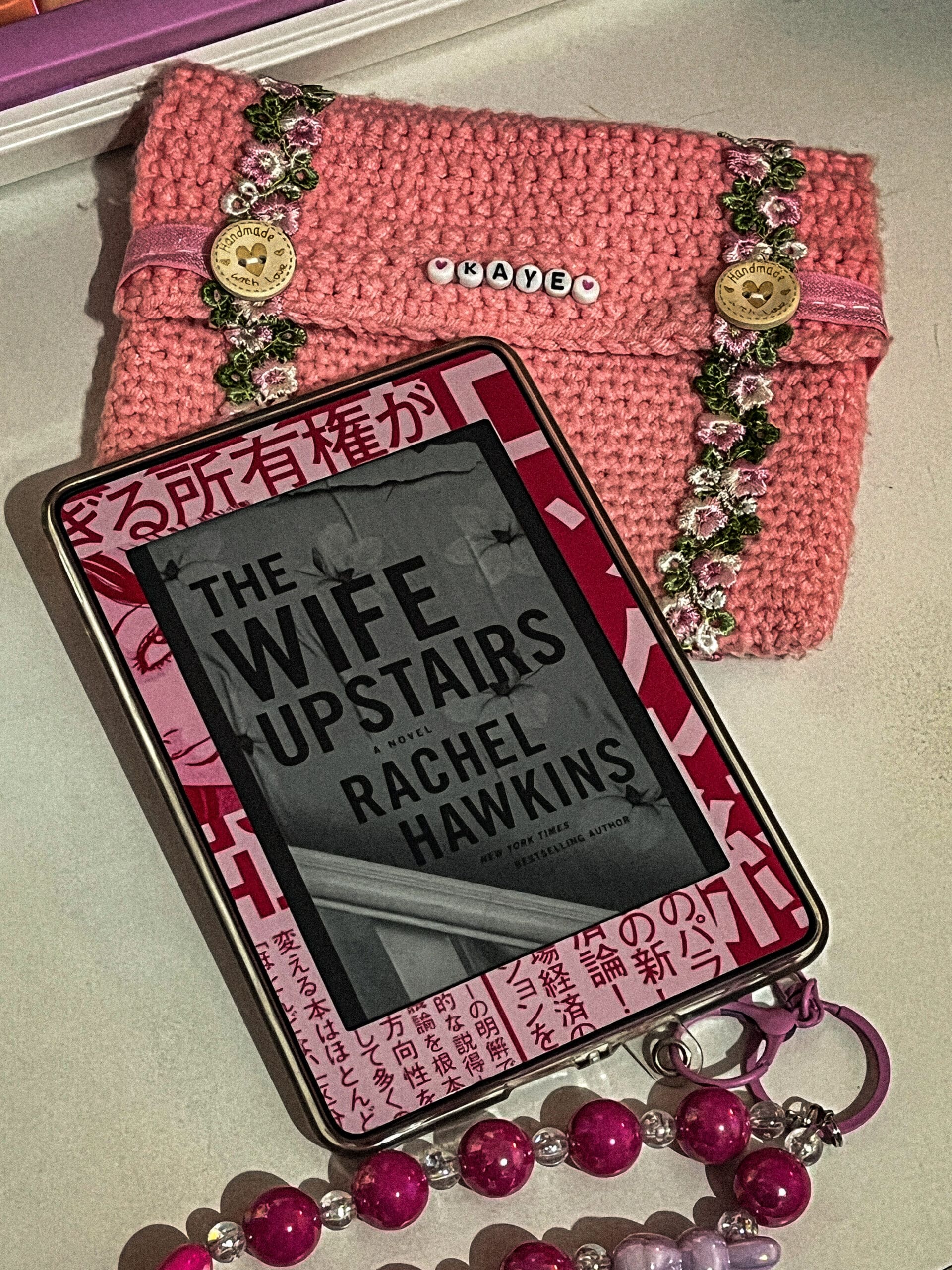 The Wife Upstairs Review featuring the hardcover edition of Rachel Hawkins' psychological thriller